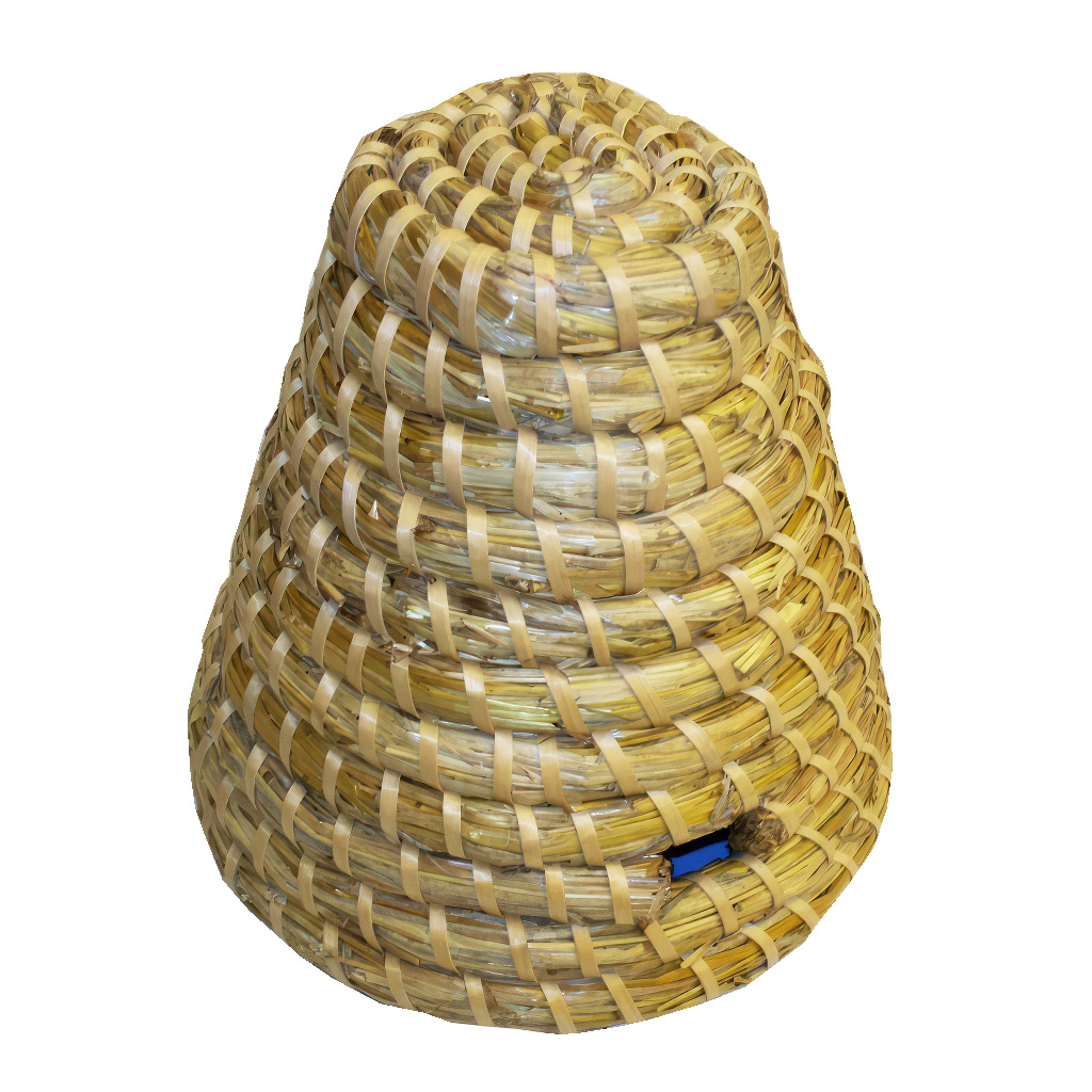 Pequeña colmena de paja